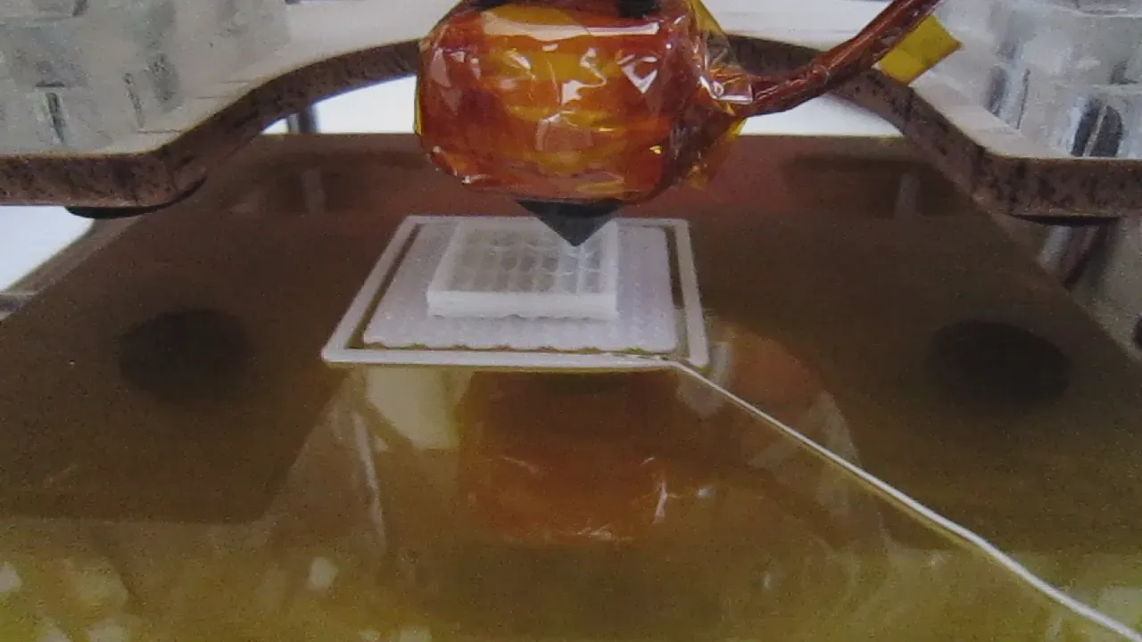 Close-up of a calibration cube print in progress