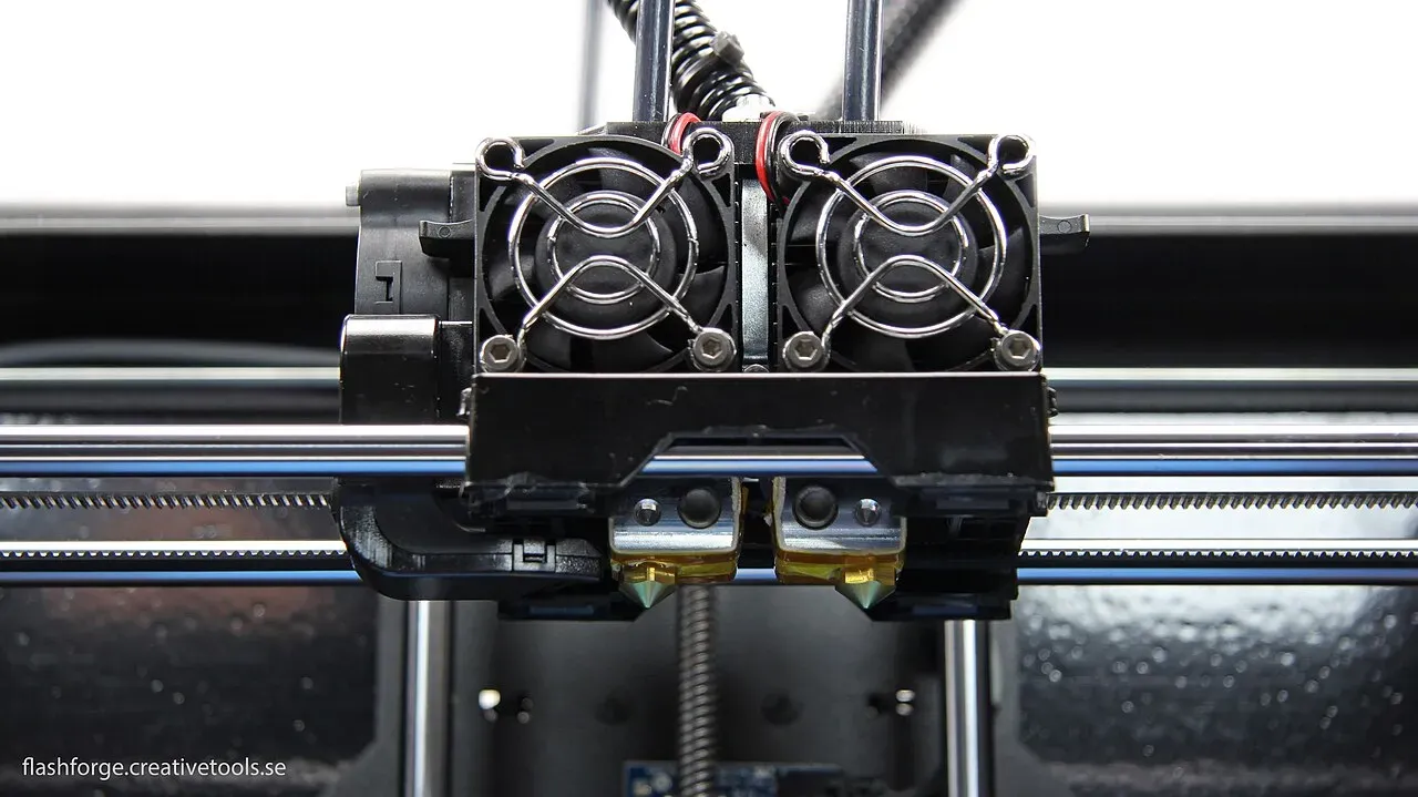 A dual-nozzle print head with two cooling fans