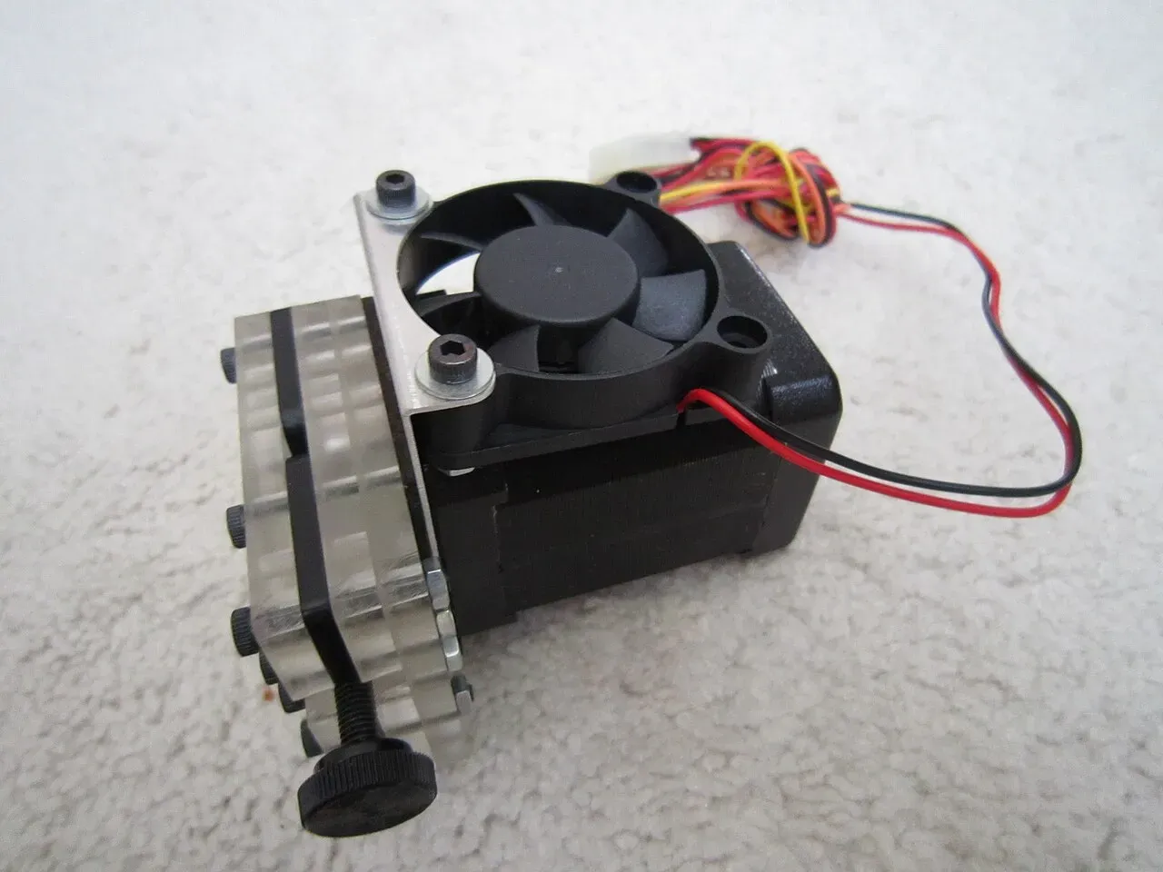 An extruder assembly with a small cooling fan attached