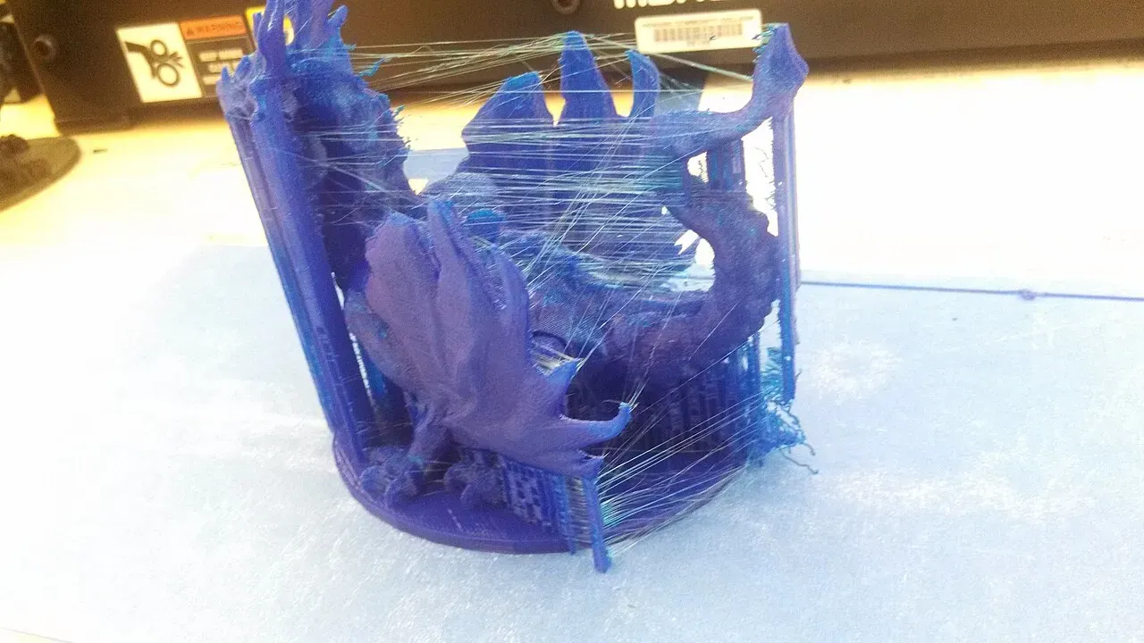 Close-up of fine strings between the spikes of a blue dragon print