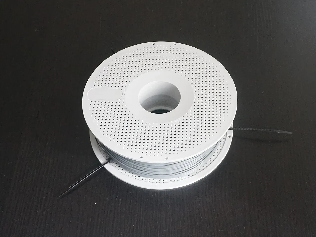 The reusable spool closed around the refill coil