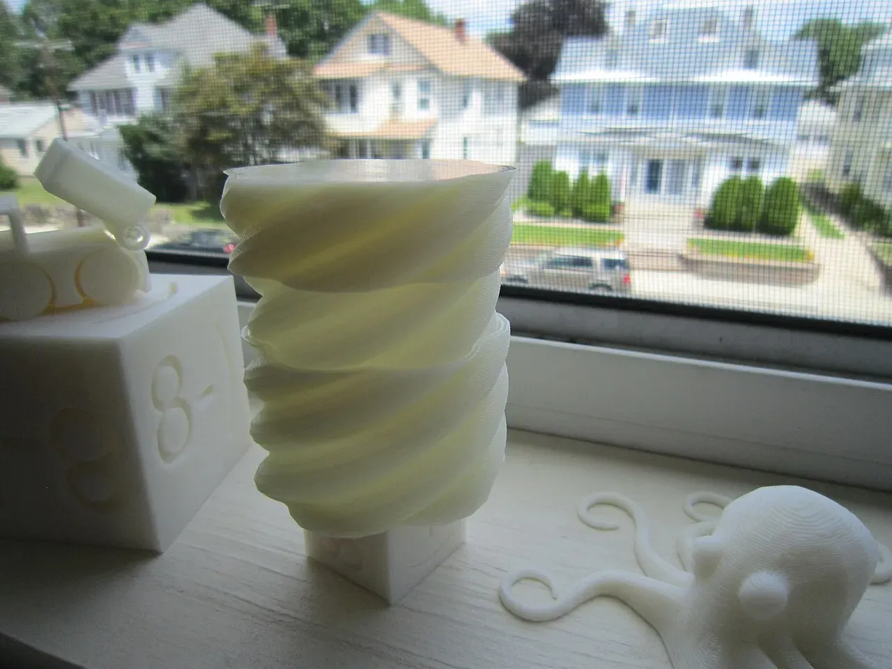A white printed screw-top box