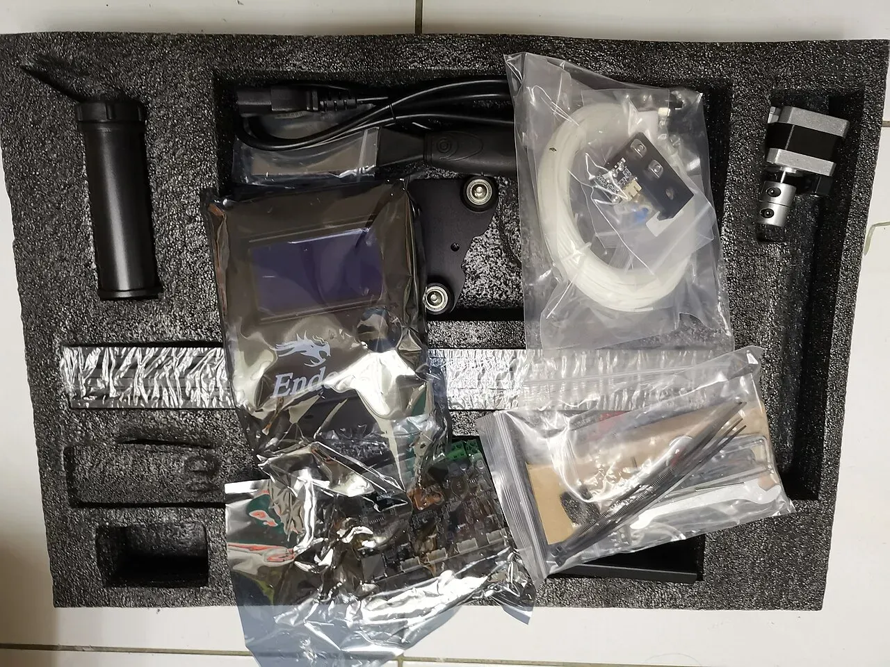 An Ender 3 printer kit in its foam packaging