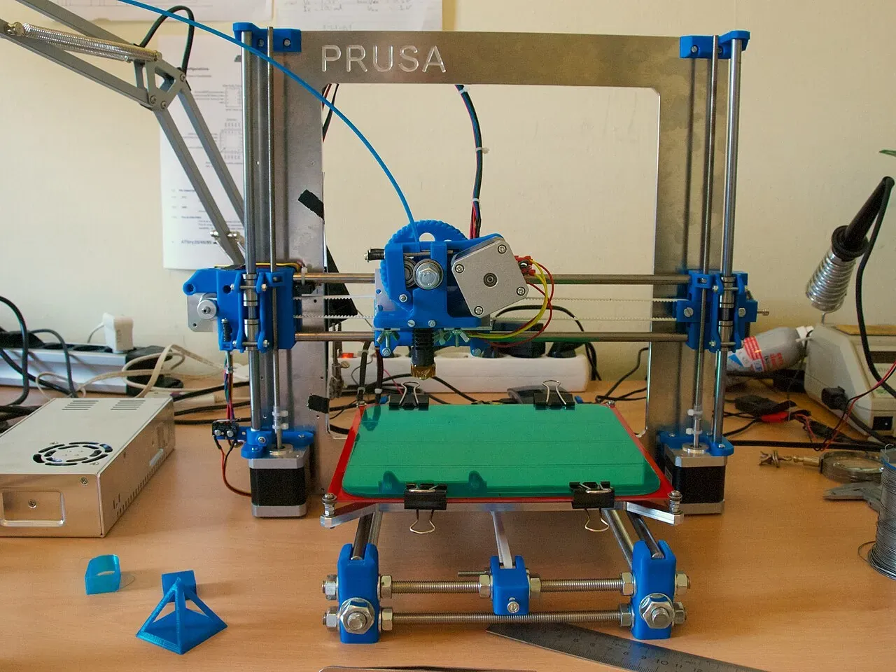 A Prusa i3 on a workbench with tools around it