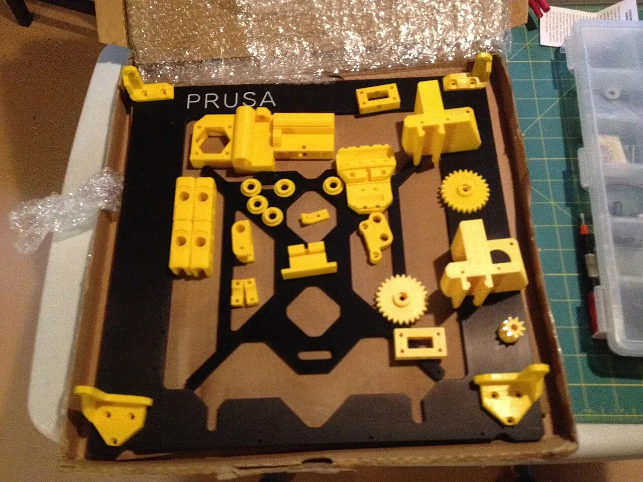 Prusa i3 printer kit parts laid out in a box