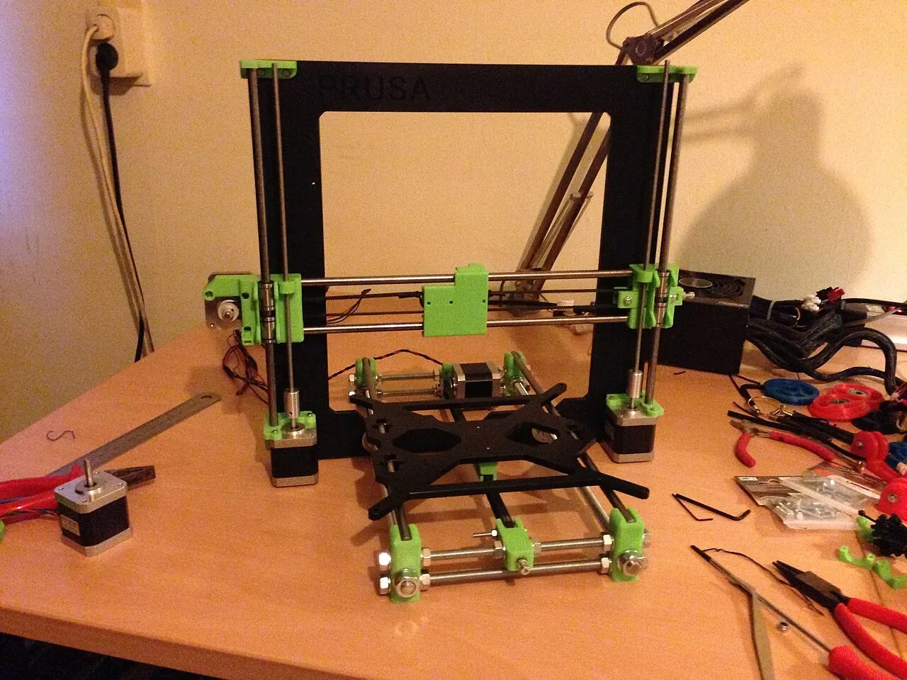 A partially built Prusa i3 frame on a table