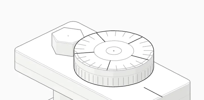 Close-up of a knurled babystep wheel marked in 0.02 mm steps